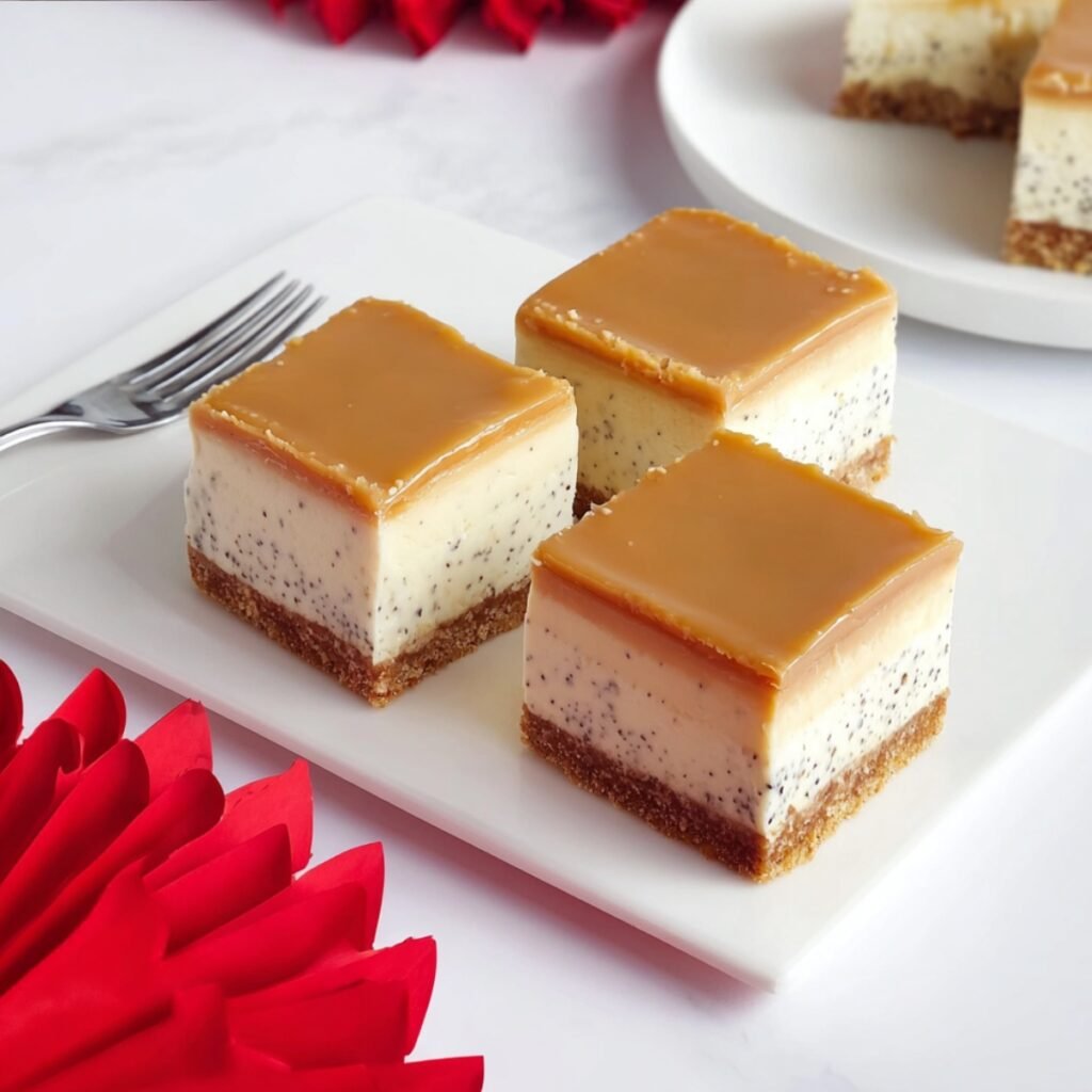 No-Bake Earl Grey Mousse Cheesecake bars on a white marble board with a golden biscuit base, speckled Earl Grey mousse layer, and smooth caramel glaze topping.