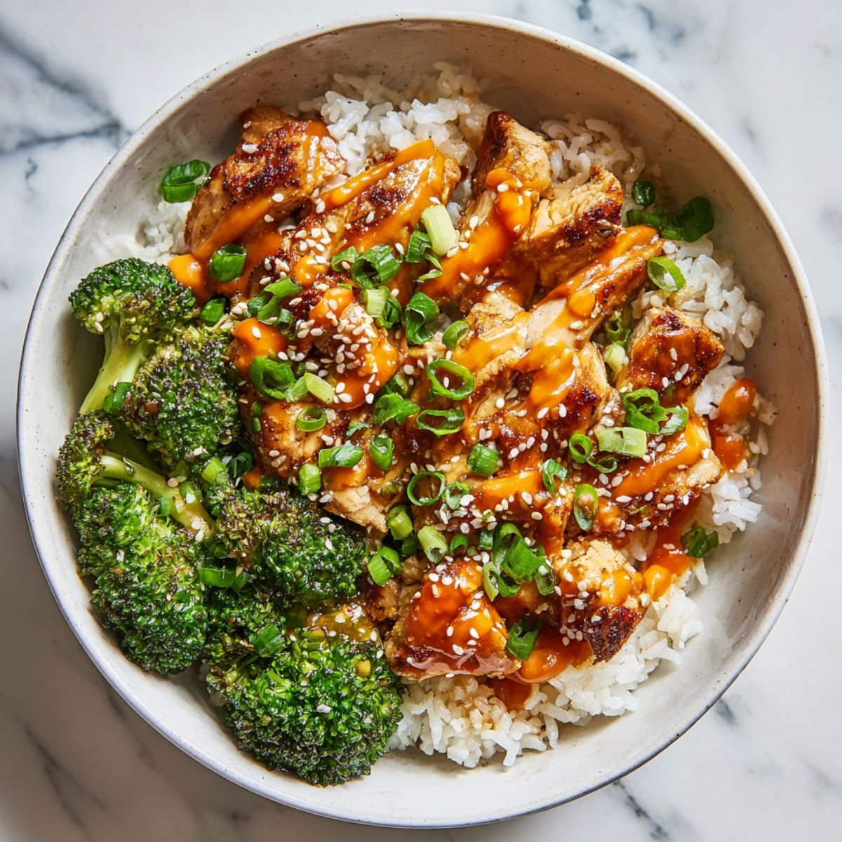 Homemade chicken rice bowl with sticky glazed chicken, steamed broccoli, and jasmine rice in white bowl - Aunty Meals healthy recipe