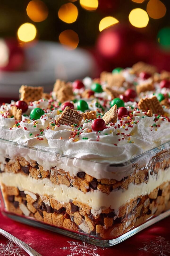 Festive 20 minute christmas cookie lasagna with cookies cream filling whipped topping and holiday sprinkles